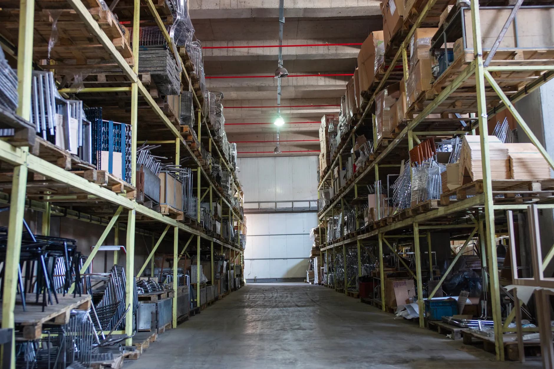 Wide warehouse aisle with industrial shelving